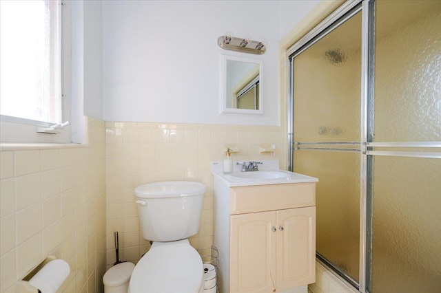 3478 Woodward St, Oceanside, NY 11572 - full bath with tile walls, a shower stall, vanity, and wainscoting