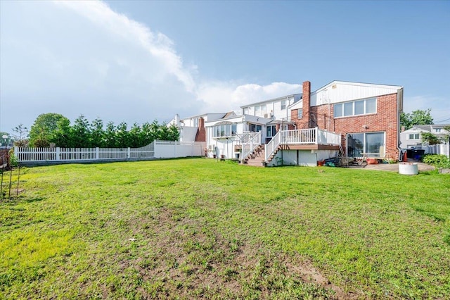 3478 Woodward St, Oceanside, NY 11572 - back of house with a fenced backyard, stairway, a wooden deck, and brick siding