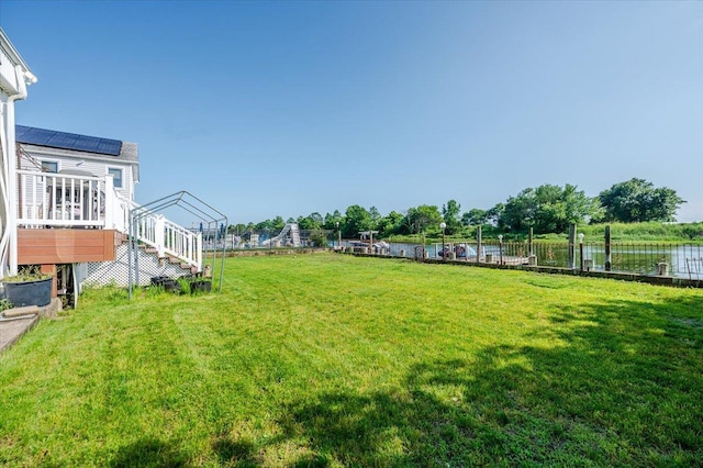 3478 Woodward St, Oceanside, NY 11572 - view of yard featuring a deck with water view and stairs