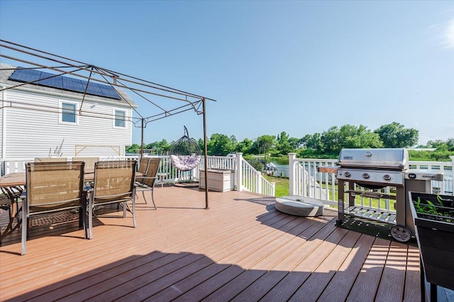 3478 Woodward St, Oceanside, NY 11572 - wooden terrace with outdoor dining area and area for grilling