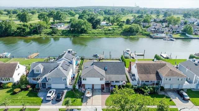 3478 Woodward St, Oceanside, NY 11572 - aerial view of residential area with a large body of water