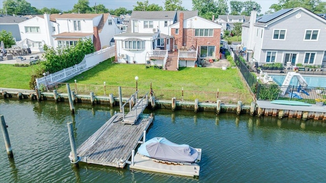 3478 Woodward St, Oceanside, NY 11572 - dock area with a fenced backyard, a residential view, a deck with water view, stairs, and a patio
