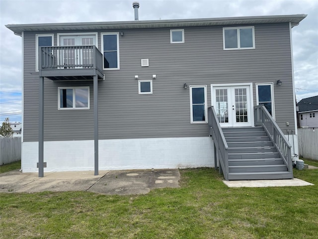 102 Surf Rd, Lindenhurst, NY 11757 - rear view of property with a balcony, french doors, and a yard