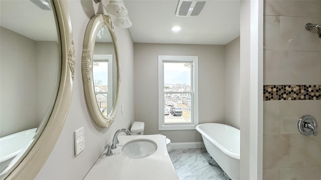 102 Surf Rd, Lindenhurst, NY 11757 - bathroom featuring marble finish flooring, a freestanding tub, and a tile shower