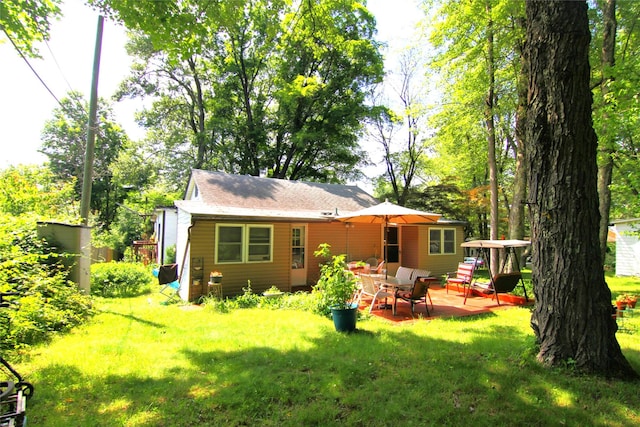 3155 Lexington Ave Unit 18Ab, Mohegan Lake, NY 10567 - back of property featuring a lawn and a patio area