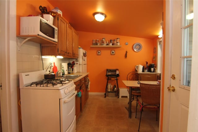 3155 Lexington Ave Unit 18Ab, Mohegan Lake, NY 10567 - kitchen with white appliances, light countertops, brown cabinets, and light tile patterned floors