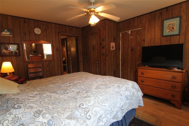 3155 Lexington Ave Unit 18Ab, Mohegan Lake, NY 10567 - bedroom with wooden walls, wood finished floors, and a ceiling fan