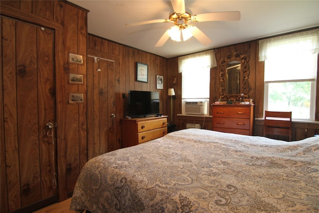 3155 Lexington Ave Unit 18Ab, Mohegan Lake, NY 10567 - bedroom with cooling unit, multiple windows, wooden walls, and a ceiling fan