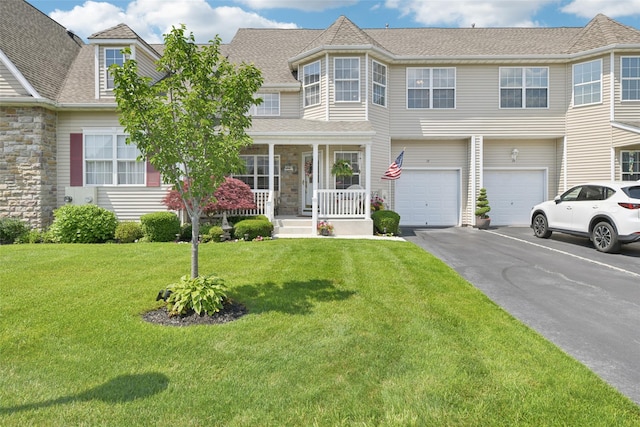 17 Meadow Pond Cir, Miller Place, NY 11764 - view of front of property with driveway, a garage, a porch, a front yard, and stone siding