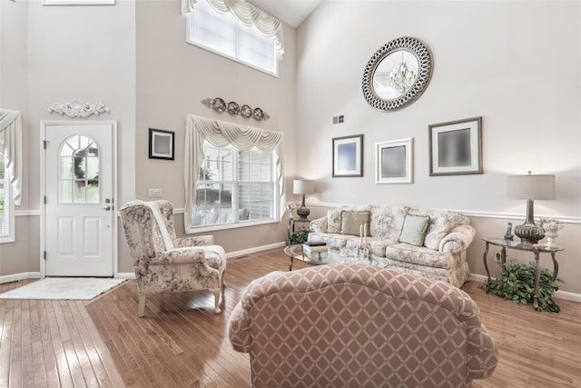 17 Meadow Pond Cir, Miller Place, NY 11764 - living room with a high ceiling and hardwood / wood-style flooring