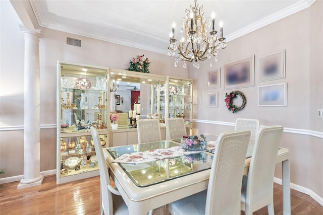 17 Meadow Pond Cir, Miller Place, NY 11764 - dining area with decorative columns, wood-type flooring, ornamental molding, and a chandelier