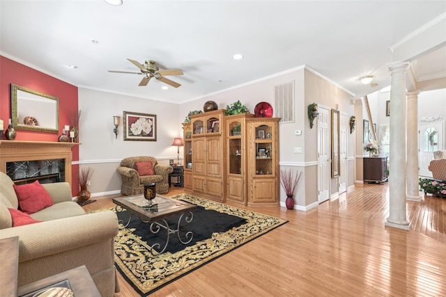 17 Meadow Pond Cir, Miller Place, NY 11764 - living area with ornate columns, crown molding, ceiling fan, wood finished floors, and recessed lighting
