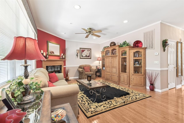 17 Meadow Pond Cir, Miller Place, NY 11764 - living room with a ceiling fan, light wood-style flooring, recessed lighting, crown molding, and a fireplace