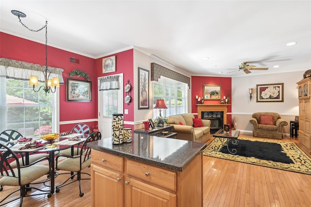 17 Meadow Pond Cir, Miller Place, NY 11764 - kitchen with a high end fireplace, a chandelier, ornamental molding, light wood-type flooring, and a ceiling fan