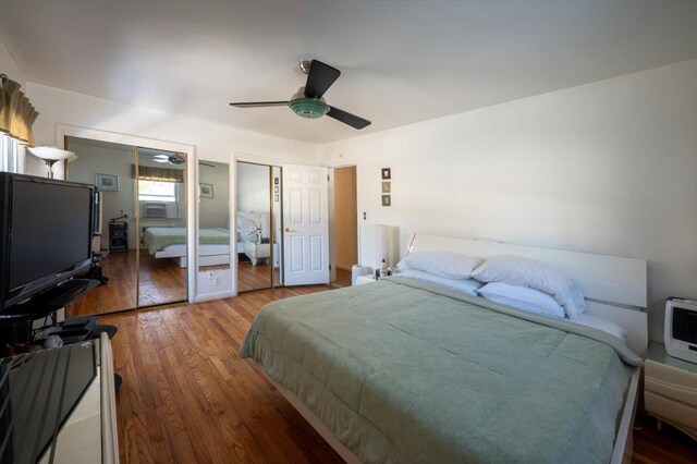 19611 Pompeii Ave, Hollis, NY 11423 - bedroom featuring multiple closets, wood finished floors, cooling unit, and a ceiling fan