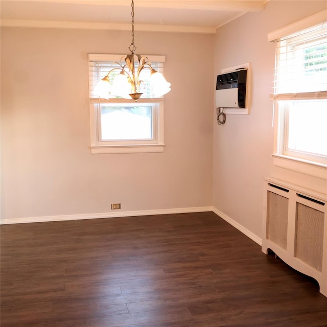 24 Pine St, Oceanside, NY 11572 - unfurnished dining area with a chandelier, dark wood-style floors, an AC wall unit, crown molding, and radiator