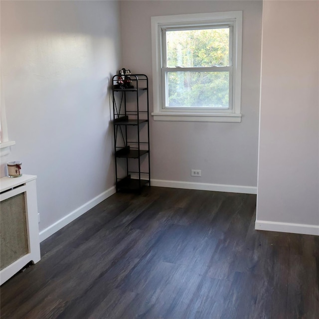 24 Pine St, Oceanside, NY 11572 - empty room featuring baseboards and dark wood-type flooring