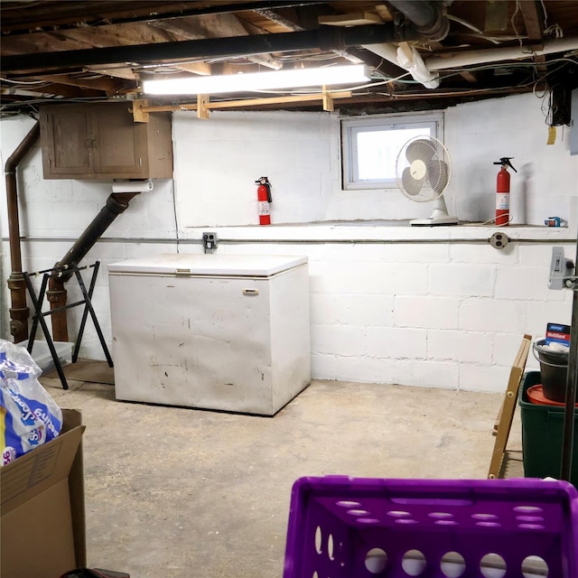 24 Pine St, Oceanside, NY 11572 - basement with fridge