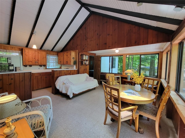 3300 Baker St Unit 16, Mohegan Lake, NY 10547 - dining area featuring light carpet and wooden walls