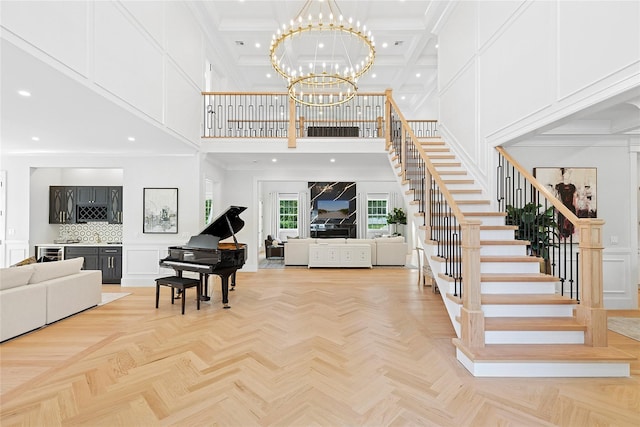 17 Chelsea Pl, Dix Hills, NY 11746 - foyer entrance with a towering ceiling, stairs, a decorative wall, recessed lighting, and a chandelier