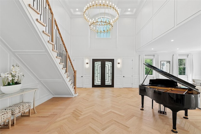 17 Chelsea Pl, Dix Hills, NY 11746 - foyer entrance with a decorative wall, a towering ceiling, stairs, a chandelier, and recessed lighting