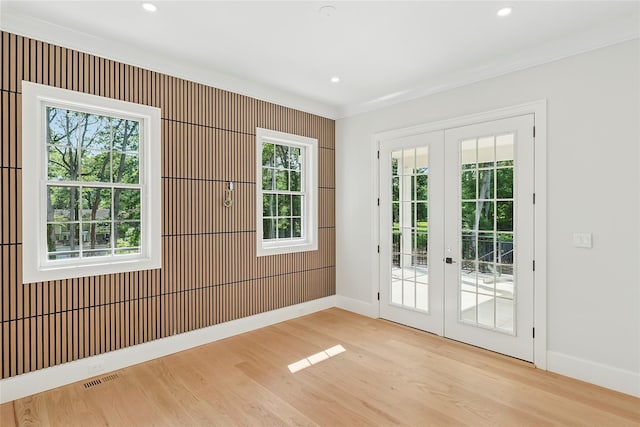 17 Chelsea Pl, Dix Hills, NY 11746 - empty room with french doors, wood finished floors, crown molding, and recessed lighting