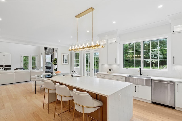 17 Chelsea Pl, Dix Hills, NY 11746 - kitchen featuring stainless steel dishwasher, french doors, light wood-type flooring, a kitchen island with sink, and recessed lighting