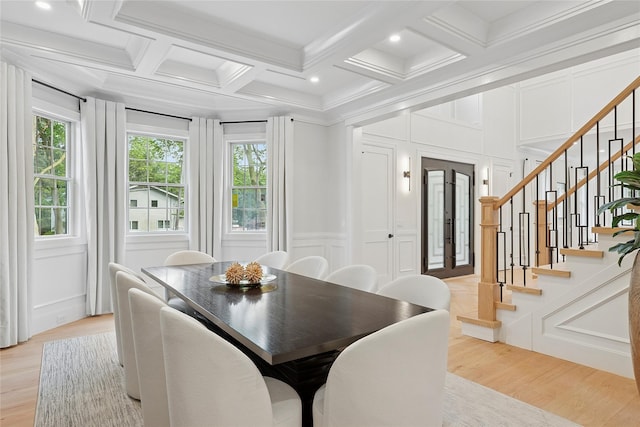 17 Chelsea Pl, Dix Hills, NY 11746 - dining area featuring a decorative wall, stairs, plenty of natural light, light wood finished floors, and coffered ceiling