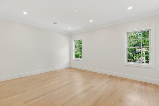 17 Chelsea Pl, Dix Hills, NY 11746 - unfurnished room with plenty of natural light, light wood-style floors, crown molding, and recessed lighting