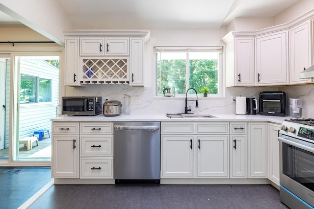 29 Meadow Ln, Chappaqua, NY 10514 - kitchen with stainless steel appliances, white cabinetry, decorative backsplash, and light countertops