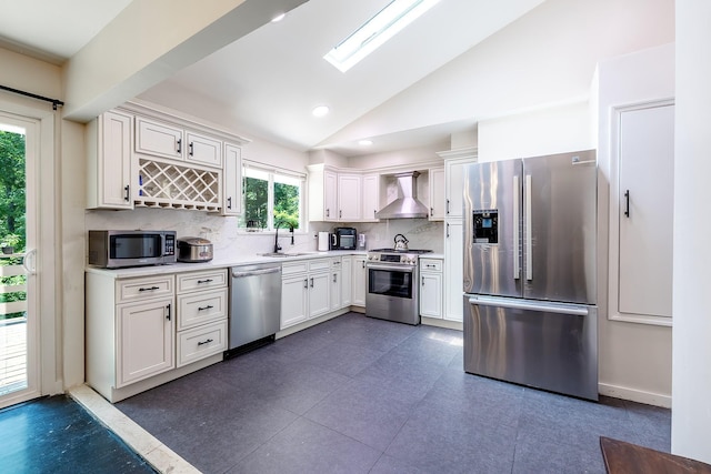 29 Meadow Ln, Chappaqua, NY 10514 - kitchen with appliances with stainless steel finishes, wall chimney range hood, lofted ceiling, backsplash, and white cabinetry