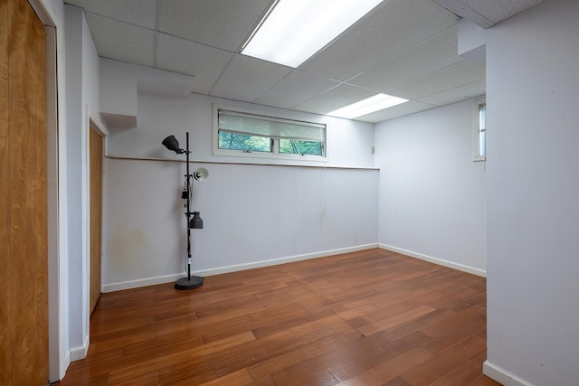 29 Meadow Ln, Chappaqua, NY 10514 - below grade area featuring a drop ceiling, wood-type flooring, and healthy amount of natural light