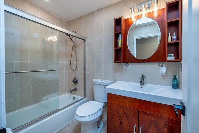 29 Meadow Ln, Chappaqua, NY 10514 - bathroom with tile walls, vanity, bath / shower combo with glass door, and decorative backsplash
