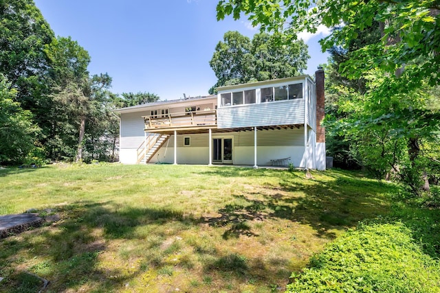 29 Meadow Ln, Chappaqua, NY 10514 - back of property featuring stairs, a deck, a sunroom, a chimney, and a yard