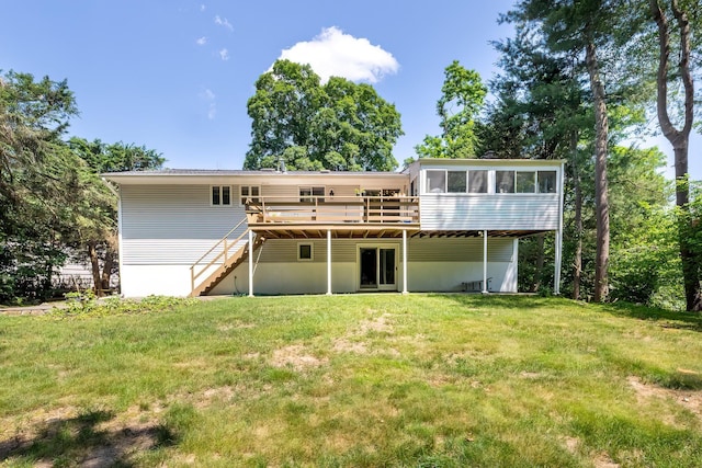 29 Meadow Ln, Chappaqua, NY 10514 - rear view of property with a sunroom, a deck, stairway, and a lawn