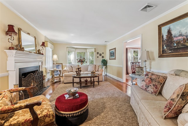 42 Roxen Rd, Rockville Centre, NY 11570 - living area featuring plenty of natural light, wood finished floors, ornamental molding, and a warm lit fireplace