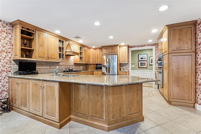 42 Roxen Rd, Rockville Centre, NY 11570 - kitchen with appliances with stainless steel finishes, a peninsula, light stone countertops, recessed lighting, and custom range hood