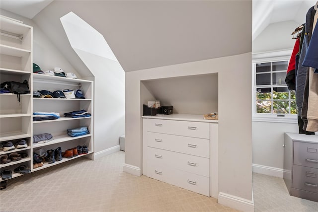 42 Roxen Rd, Rockville Centre, NY 11570 - spacious closet featuring lofted ceiling, light carpet, and a skylight