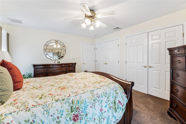 42 Roxen Rd, Rockville Centre, NY 11570 - bedroom featuring dark colored carpet, two closets, and a ceiling fan