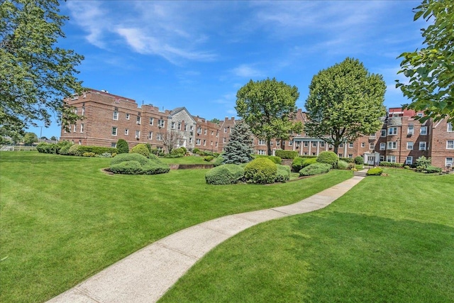 104 S Village Ave S Unit 1F, Rockville Centre, NY 11570 - view of property's community featuring a lawn