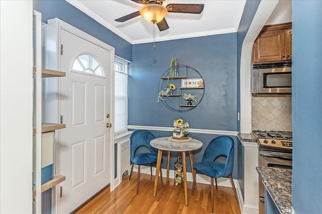 104 S Village Ave S Unit 1F, Rockville Centre, NY 11570 - foyer with light wood-type flooring, ceiling fan, and ornamental molding