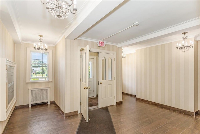104 S Village Ave S Unit 1F, Rockville Centre, NY 11570 - entrance foyer with a chandelier, radiator heating unit, ornamental molding, dark wood-type flooring, and wallpapered walls