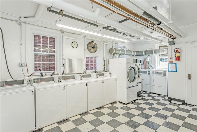 104 S Village Ave S Unit 1F, Rockville Centre, NY 11570 - community laundry with washing machine and clothes dryer and light floors