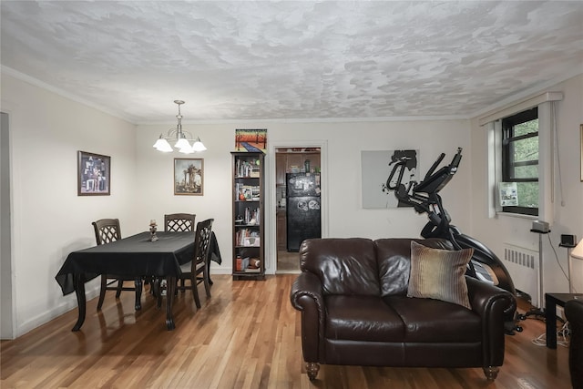 160-54 Willets Point Blvd Unit 4-206, Whitestone, NY 11357 - living area featuring a chandelier, wood finished floors, radiator heating unit, and crown molding