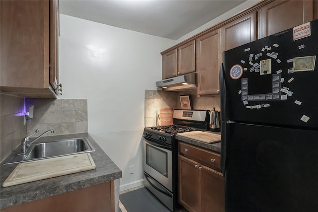 160-54 Willets Point Blvd Unit 4-206, Whitestone, NY 11357 - kitchen with freestanding refrigerator, stainless steel range with gas cooktop, under cabinet range hood, and backsplash