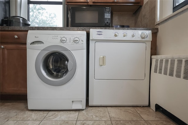 160-54 Willets Point Blvd Unit 4-206, Whitestone, NY 11357 - laundry room featuring washer and dryer, cabinet space, and light tile patterned floors