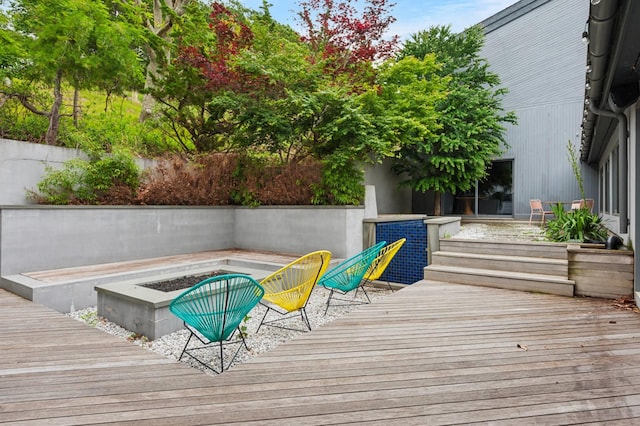 55C Shore Rd, Shelter Island, NY 11964 - wooden deck featuring a fire pit