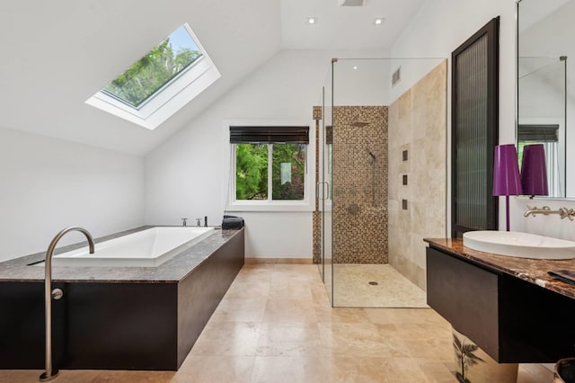 55C Shore Rd, Shelter Island, NY 11964 - full bath featuring a skylight, vaulted ceiling, a stall shower, a garden tub, and vanity