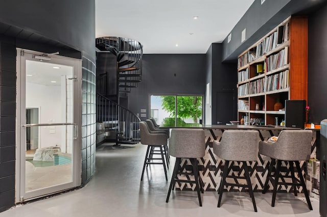 55C Shore Rd, Shelter Island, NY 11964 - dining area with stairs, finished concrete floors, and recessed lighting
