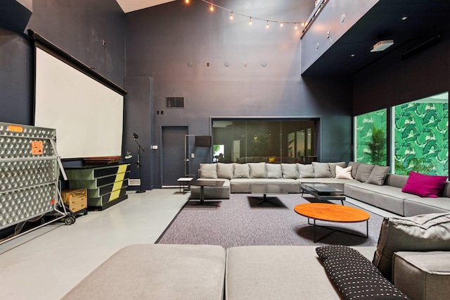 55C Shore Rd, Shelter Island, NY 11964 - home theater featuring a high ceiling and concrete flooring